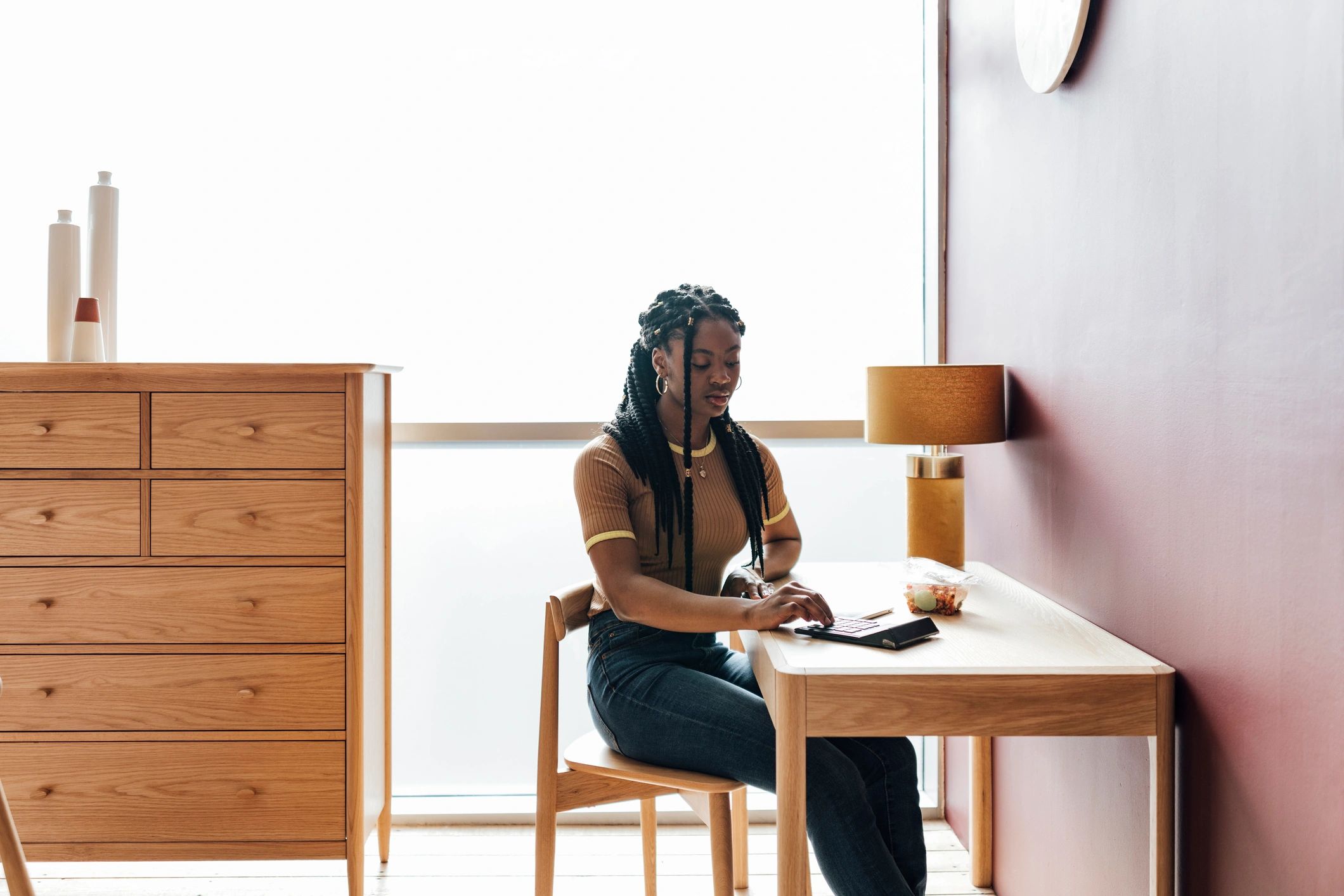 Author writing notes at a desk